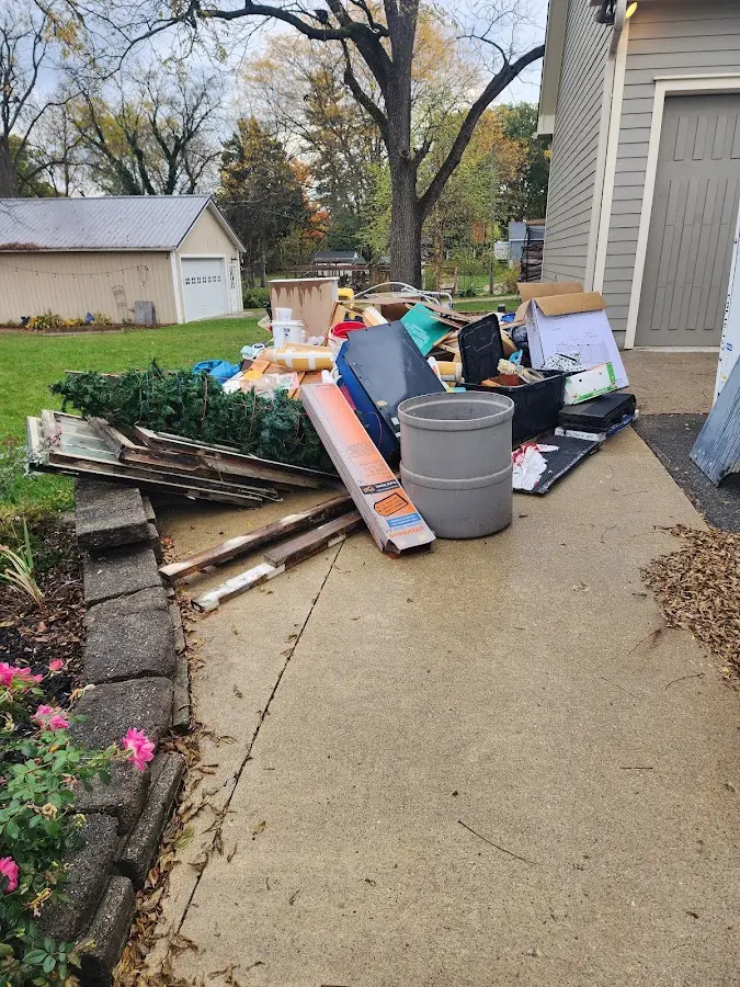 Dumpster being loaded with debris for Roofing Dumpster Rental in Wauchula